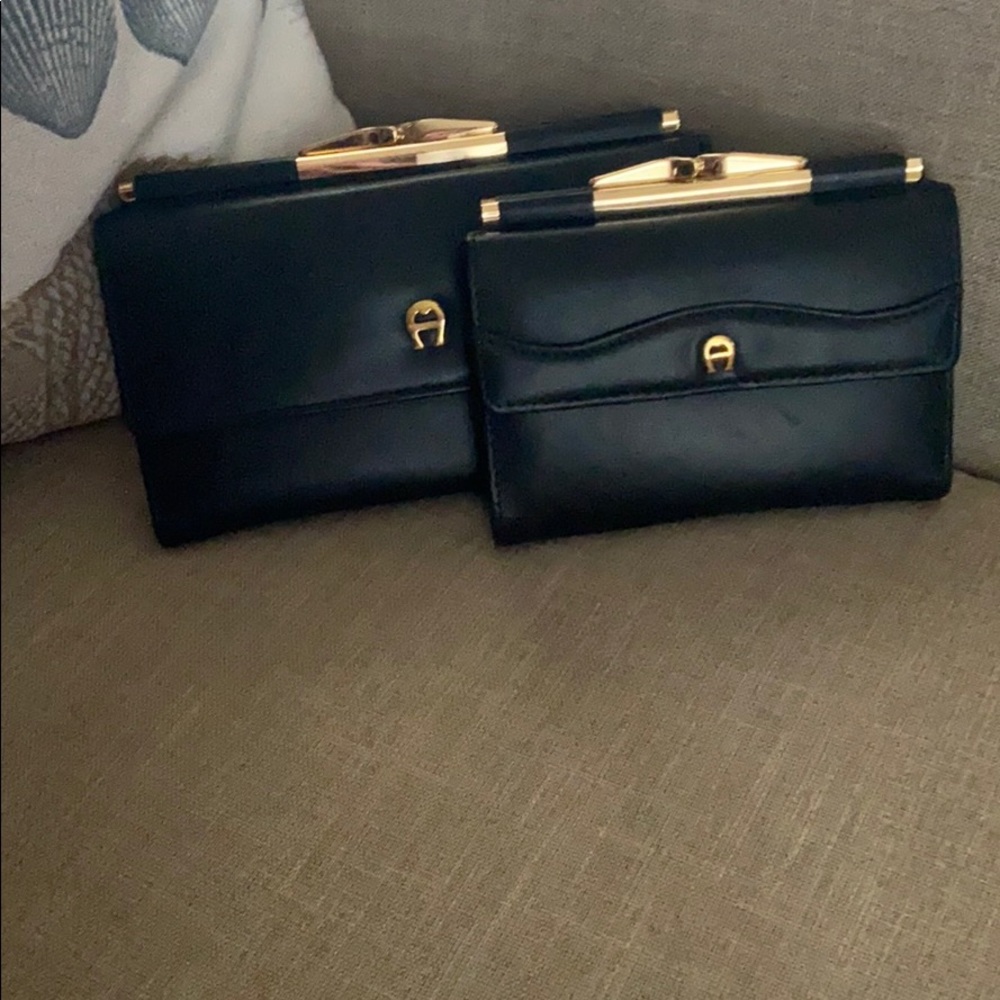 2 black wallets etienne aigner
